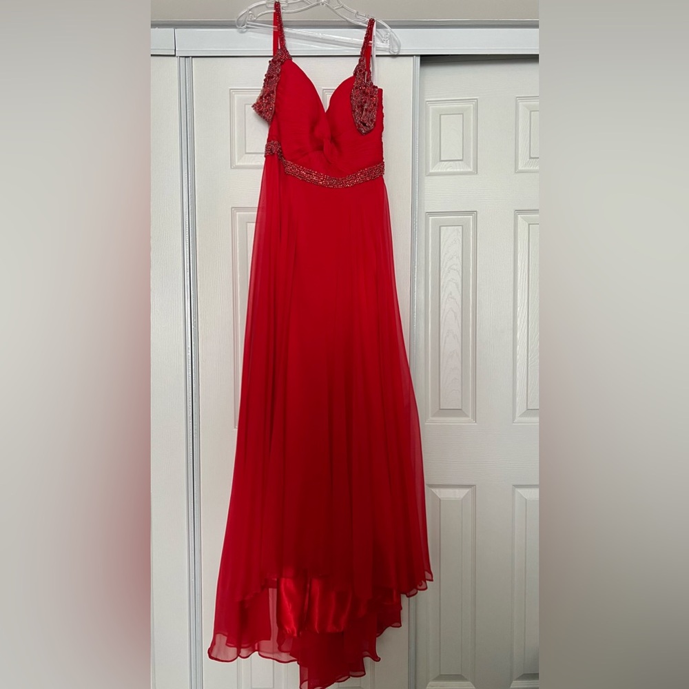 A beautiful red Sherri Hill dress. It’s like new, no tags.